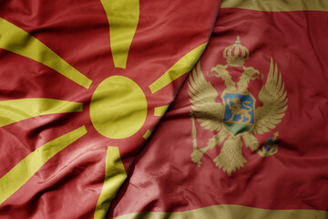 big waving national colorful flag of macedonia and national flag of montenegro .
