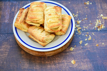 Fresh baked home made  Mini cheese puff pastries.Cheese pie with phyllo pastry and herbs