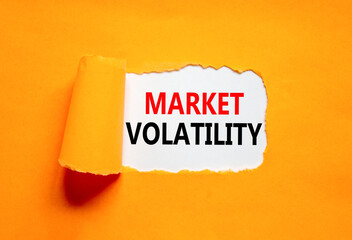 Market volatility symbol. Concept words Market volatility on beautiful white paper. Beautiful orange paper background. Business market volatility concept. Copy space.orange
