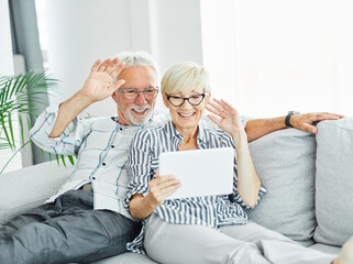 woman couple senior man happy internet love tablet call video communication online internet mature active elderly retirement computer technology online using  talking video call connection home