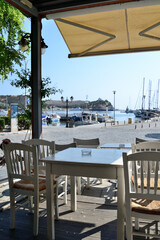 table and chairs in a port restaurant