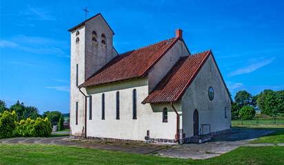 Fototapeta na wymiar Built in 1934, the Catholic Church of St. St. Anthony of Padua in Napierki, Warmia, Poland.