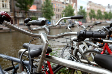 Row of bicycles in Amsterdam, Netherlands, next to the water