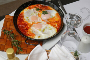 Italian shakshuka - Poached eggs in tomato sauce - a healthy one-pan meal	