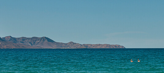a panoramic view of isla espiritu santo from el tecolote beach in la paz baja california sur. Mexico. summer vacation period, sea of cortes - obrazy, fototapety, plakaty