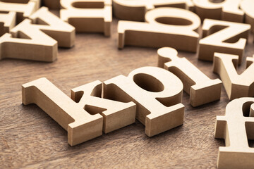 KPI (Key Perfomance Indicator) in the group of wooden English alphabets