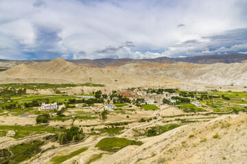 Fototapeta na wymiar Landscape view of Kingdom of Lo Manthang with Green Tibetan Desert Background in Mustang of Nepal