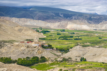 Namgyal Gompa Gumba Monastery in Upper Mustang of Tibetan Nepal with beautiful green desert