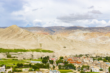 Landscape view of Kingdom of Lo Manthang with Green Tibetan Desert Background in Mustang of Nepal