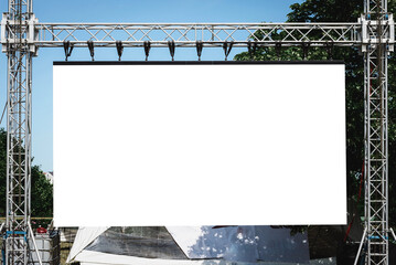 Banner white empty mockup billboard.Equipment on stage for the concert.Projector Screen.Municipal...