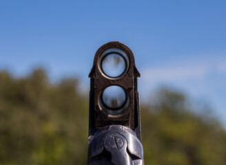 The barrel of a double-barreled hunting rifle.
