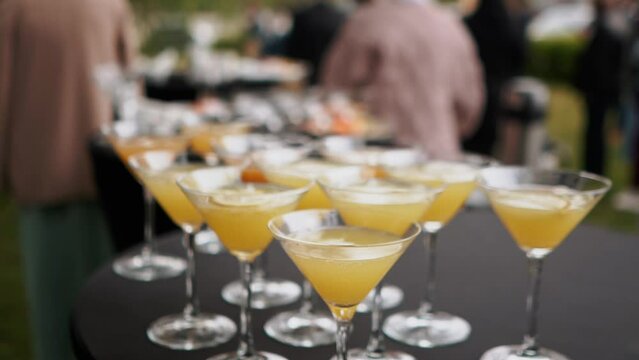 Champagne in glass glasses stands on a wedding buffet on the table during the wedding ceremony