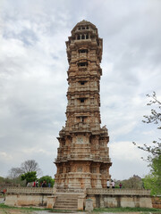 Picture of Vijay Stambha at Chittorgarh Fort shot during daylight against blue sky and white clouds