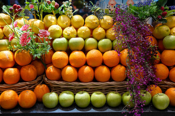 Various type of fresh fruits arrange neatly grocery store. Apple, Orange and Lemon on rack.