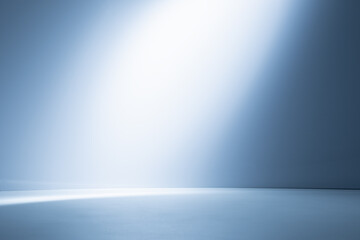 Empty light blue background for product presentation with light and shadow on the wall and floor