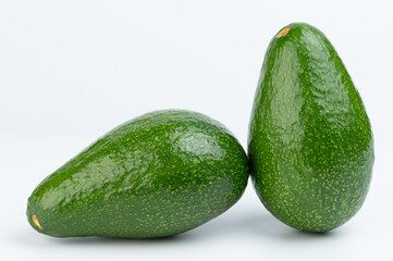 Two real green avocado