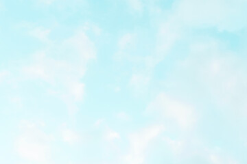 Blue pastel sky with white fluffy cloud. Soft, smooth and blurry cloudscape background. Beautiful morning summer sky. Freedom of life, new life beginning, positive energy and never give up concept.