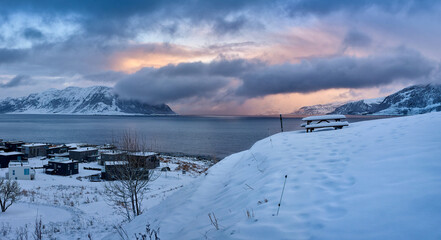 Sunset panorama over a winter Godøy, Ålesund, Norway
