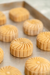 Mooncake making process. A mooncake  is a Chinese bakery product traditionally eaten during the Mid-Autumn Festival.