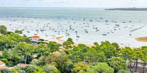 Boats and Arcachon Bay on the belisaire district in Cap Ferret, France