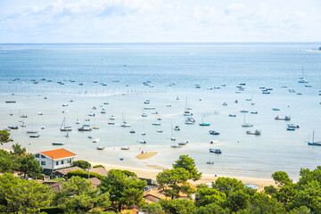 Boats and Arcachon Bay on the belisaire district in Cap Ferret, France 