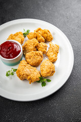 chicken nuggets tomato sauce deep-fried meat ready to eat healthy meal food snack on the table copy space food background rustic top view