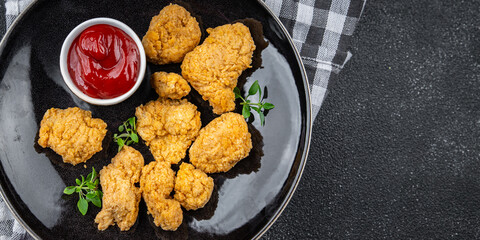 chicken nuggets tomato sauce deep-fried meat ready to eat healthy meal food snack on the table copy space food background rustic top view