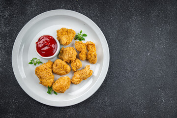 chicken nuggets tomato sauce deep-fried meat ready to eat healthy meal food snack on the table copy space food background rustic top view