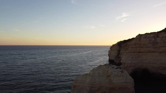 Aerial Drone Moving in Towards Rocks and Ocean. Portugal Ocean Coast by Banagil Caves.
