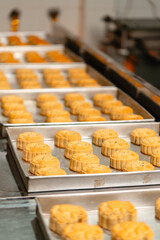 Mooncake making process. A mooncake  is a Chinese bakery product traditionally eaten during the Mid-Autumn Festival.