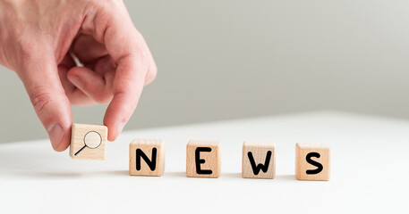 Wooden news sign on a table in an office