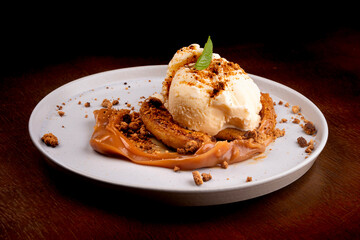 banoffee dessert with banana dulce de leche vanilla ice cream and angle-ground biscuit
