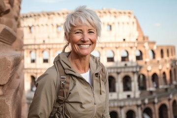Environmental portrait photography of a grinning mature woman wearing a technical climbing shirt against the colosseum in rome italy. With generative AI technology