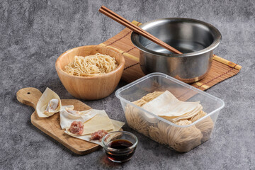 Homemade noodles and minced pork dumplings set, Asian cooking concept