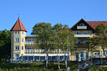 A view of historic hotel building on sand dune, Leba beach, Baltic Sea, Poland. Castle on the beach. Beautiful sunny weather © PaulSat