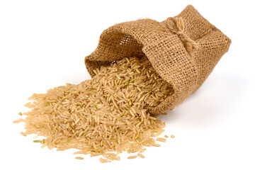 Raw brown rice in rustic burlap. isolated on white background.