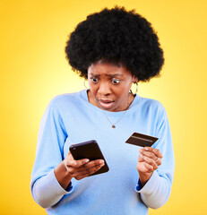 Surprised, credit card and woman with phone scam and shock from problem and tech in studio. Stress, mobile and confused from phishing, hacking and ecommerce spam with anxiety and yellow background