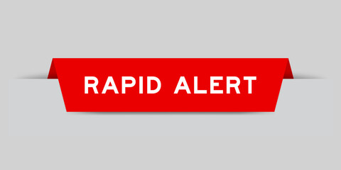 Red color inserted label with word rapid alert on gray background