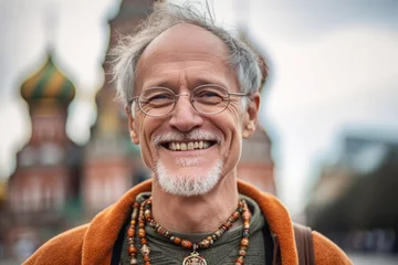 Foto op Canvas Headshot portrait photography of a joyful mature man wearing a delicate necklace in front of the saint basils cathedral in moscow russia. With generative AI technology © Markus Schröder