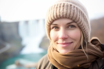 Close-up portrait photography of a satisfied girl in her 30s wearing a thermal merino wool top at the niagara falls in ontario canada. With generative AI technology