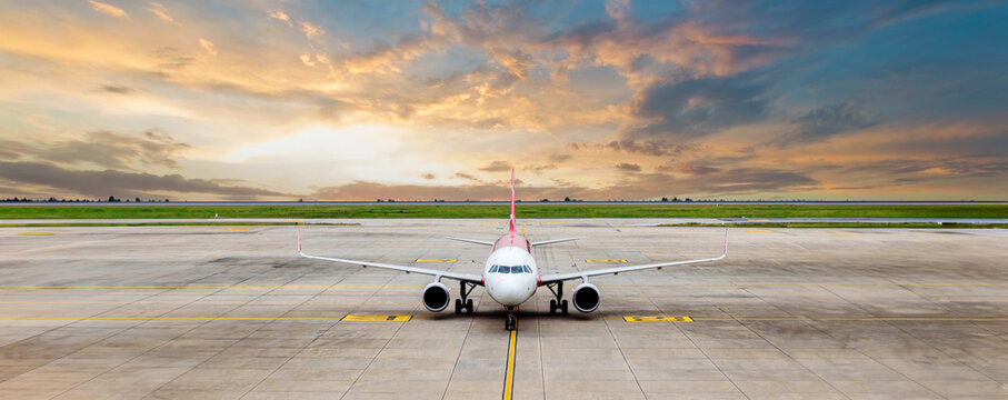 Airplane taxi in taxiway after landing and prepare to park in passenger gate.