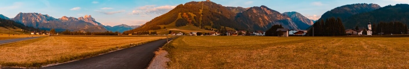 High resolution stitched alpine summer sunset panorama at the Tannheimer Tal valley, Reutte, Tyrol, Austria