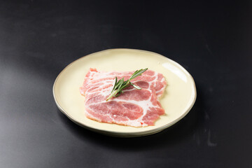 Fresh raw sliced pork belly. Sliced pork neck and pork belly. Japanese and korean rare beef for grilled on black plate food isolated on black banner background