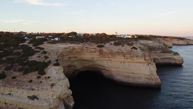 Aerial View of the Ocean Shoreline and City up on the Rocks. Still video landscape of the sea off the coast.