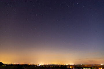 Stars sky with Milky Way in front of a forest