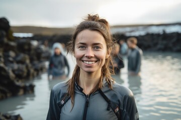Environmental portrait photography of a grinning girl in her 30s wearing a lightweight base layer at the blue lagoon in reykjavik iceland. With generative AI technology - obrazy, fototapety, plakaty