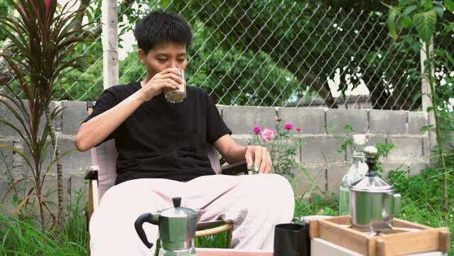  Enjoyment, Asian single dinking coffee in the garden