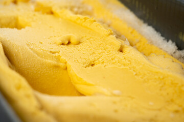 Mango yellow ice cream top view close-up
