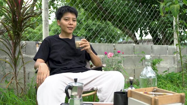  Enjoyment, Asian single dinking coffee in the garden