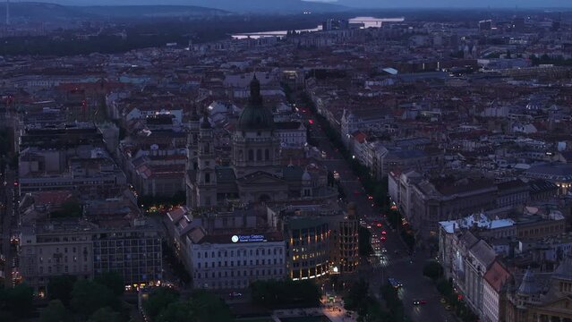 Szent Istvan bazilika at dusk. Aerial view of famous basilica with large dome and two shin towers. Budapest, Hungary